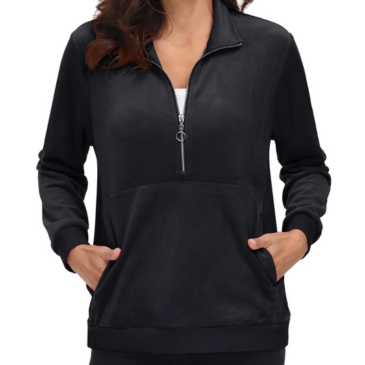 Active senior modeling Women's Half Zip Fleece Pullover Hoodie while stretching outdoors, demonstrating flexibility