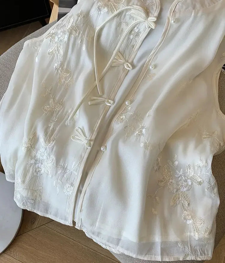 Back view of breathable sleeveless blouse showing lightweight flow and movement, perfect for warm summer days.