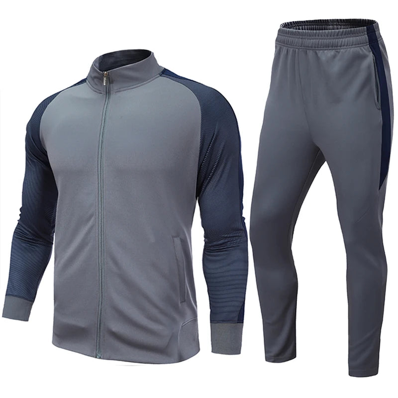 A two-piece men's soccer training tracksuit set in navy and green colors, including a full-zip jacket and matching elastic-waist pants.