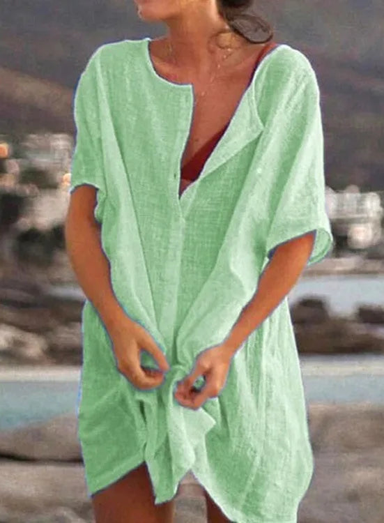 Blue cotton-linen tunic top with vintage-inspired button front and soft stretch for active women over 60.