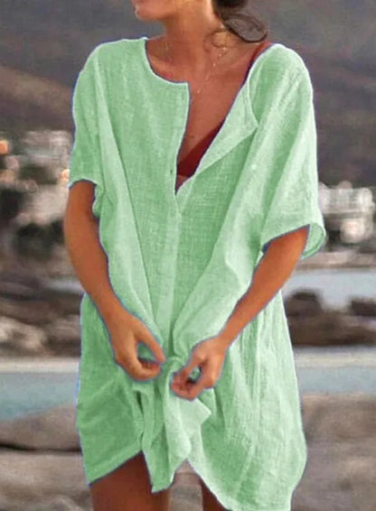 Blue cotton-linen tunic top with vintage-inspired button front and soft stretch for active women over 60.