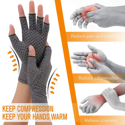A pair of gray magnetic compression therapy gloves with an open-fingertip design, shown being worn by a person. The gloves appear to be made of a breathable fabric and are designed to provide joint support and pain relief.