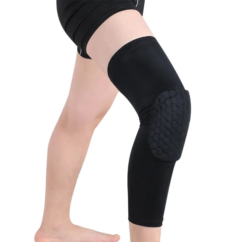 A display of sports knee compression braces in black color, with one brace shown in detail to highlight the silicone strips and honeycomb padding.